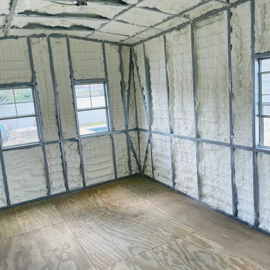 Closed-cell spray foam insulation applied to wall cavities in a residential project in Farmington